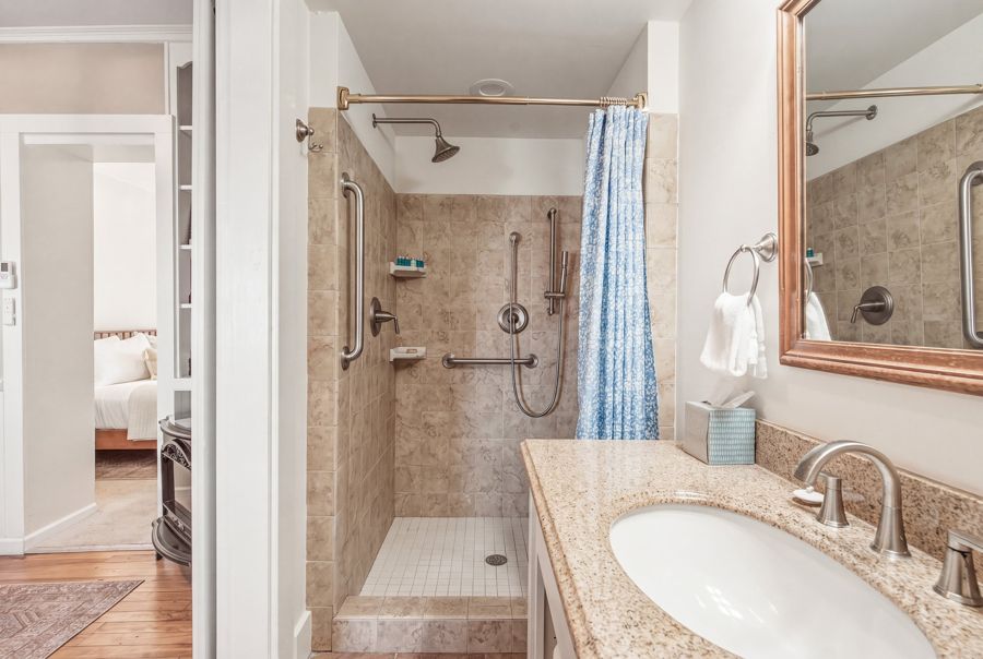 Tiled walk-in shower and long vanity