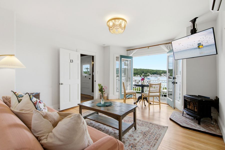 The living room, stove and balcony doors